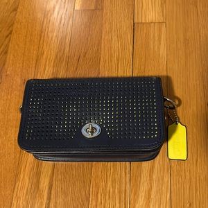 Navy blue and neon yellow Coach crossbody